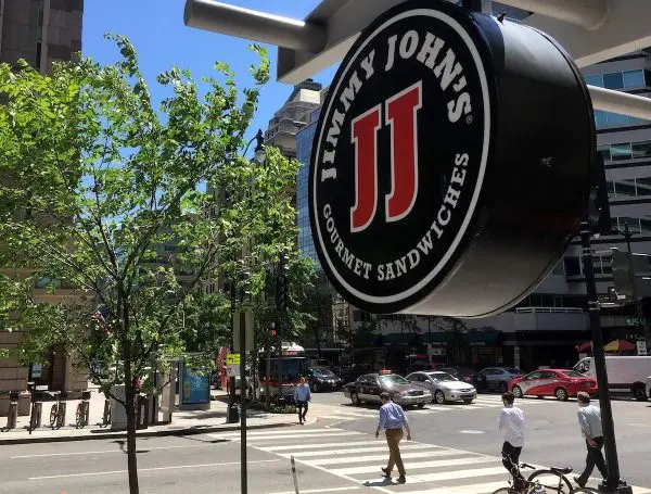 On June 9, 2016, a symbol of the sandwich chain Jimmy John's hangs atop one of their stores in city Washington. ( Mladen Antonov /AFP/Getty Images )