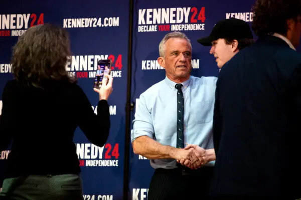 Separate presidential candidate Robert F. Kennedy Jr. poses with followers during a meet and greet after a vote rally at St. Cecilia Music Center in Grand Rapids, Mich., on Feb. 10, 2024. ( Emily Elconin/Getty Images )