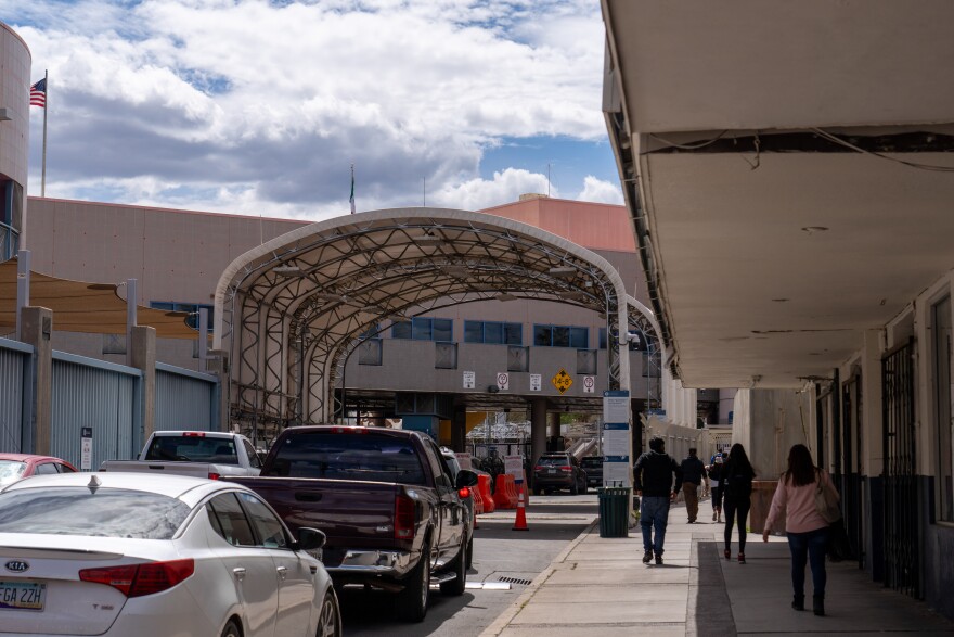 People travel and move across the border through the Nogales port of entry in Arizona.