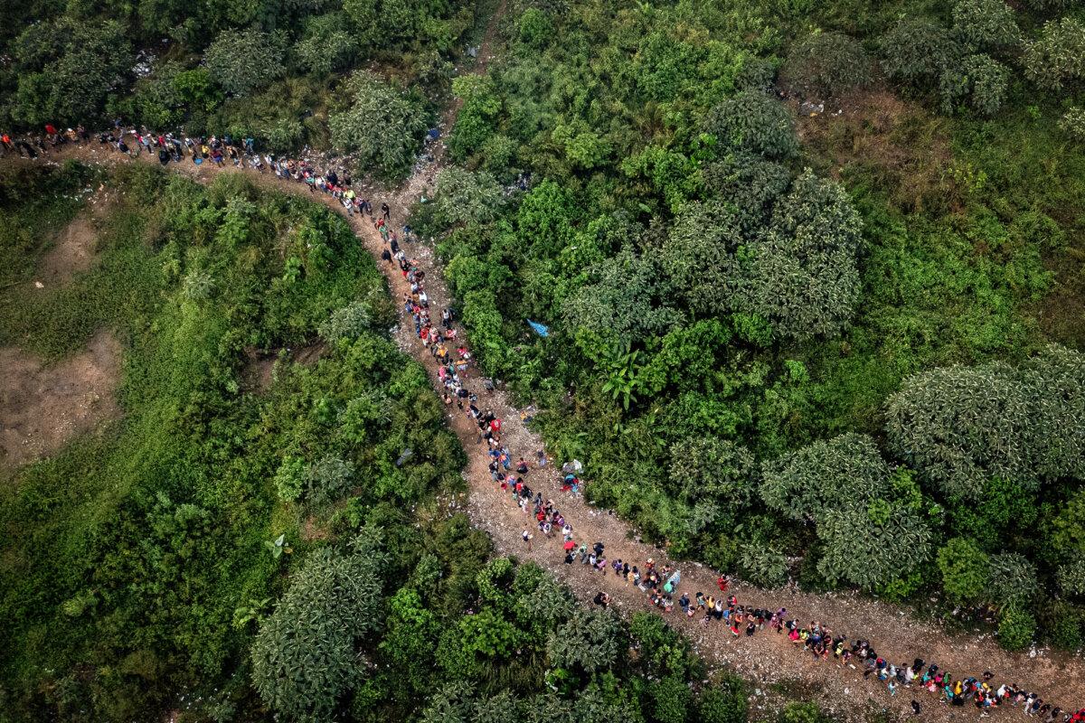 Migrants walk through the jungle near Bajo Chiquito village, the first border control of the Darién Province in Panama, on Sept. 22, 2023. ( Luis Acosta/AFP via Getty Images )