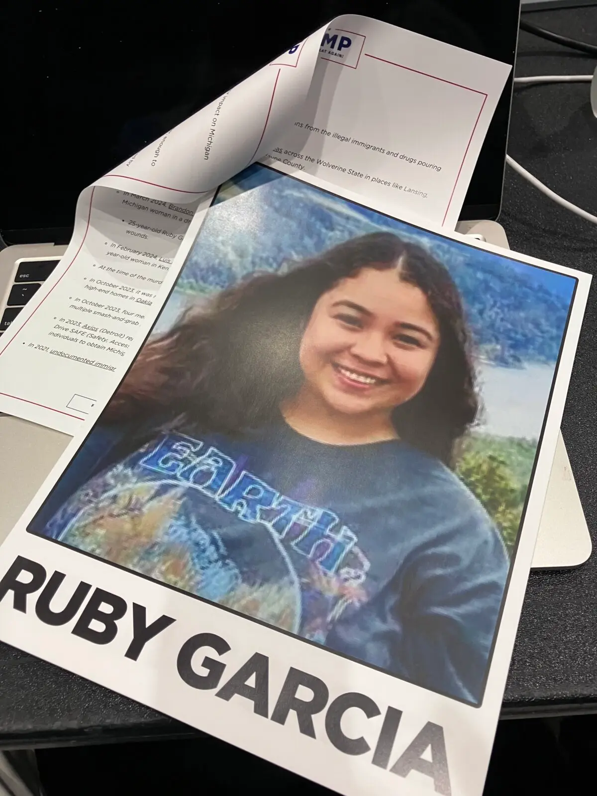 A handout from former President Donald Trump's campaign displayed a photograph of Ruby Garcia, 25, of Grand Rapids, Mich., as an example of a killing allegedly committed by an illegal immigrant, at a speech in Grand Rapids on April 2, 2024. ( Janice Hisle/The Epoch Times )