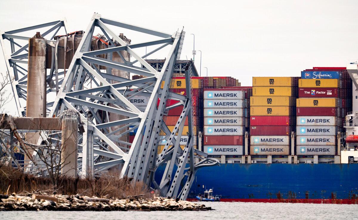 The cargo ship Dali sits in the water after running into and collapsing the Francis Scott Key Bridge in Baltimore, Maryland, on March 26, 2024. ( Kevin Dietsch/Getty Images )