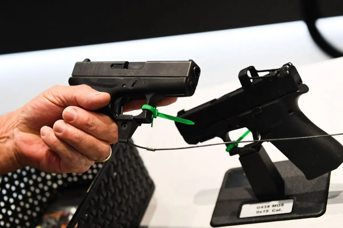 A Glock Ges is a presenter's weapon. m. b. H. pistol during the National Rifle Association ( NRA ) Annual Meeting at the George R. Brown Convention Center, in Houston, Texas on May 28, 2022. ( Patrick Fallon/AFP via Getty Images )