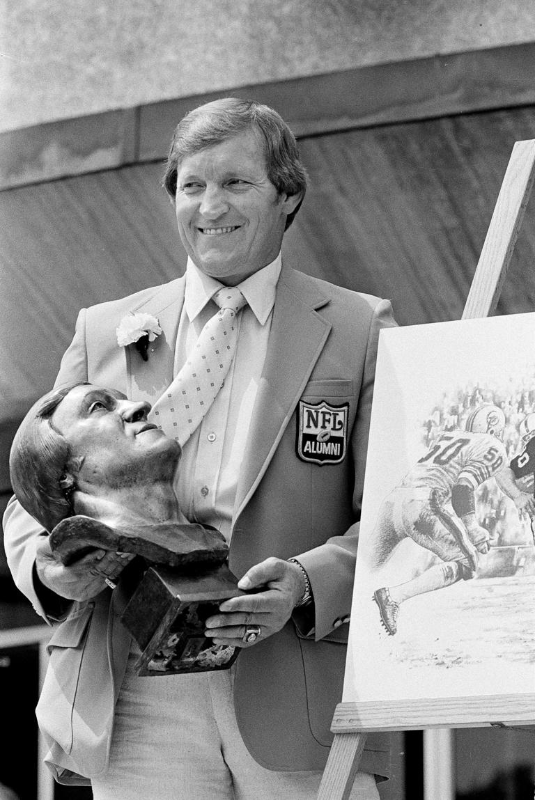 Jim Otto, past centre for the Oakland Raiders, poses with his knock after enshrinement in the Pro Football Hall of Fame in Canton, Ohio, Aug. 2, 1980. Otto, the Hall of Fame centre known as